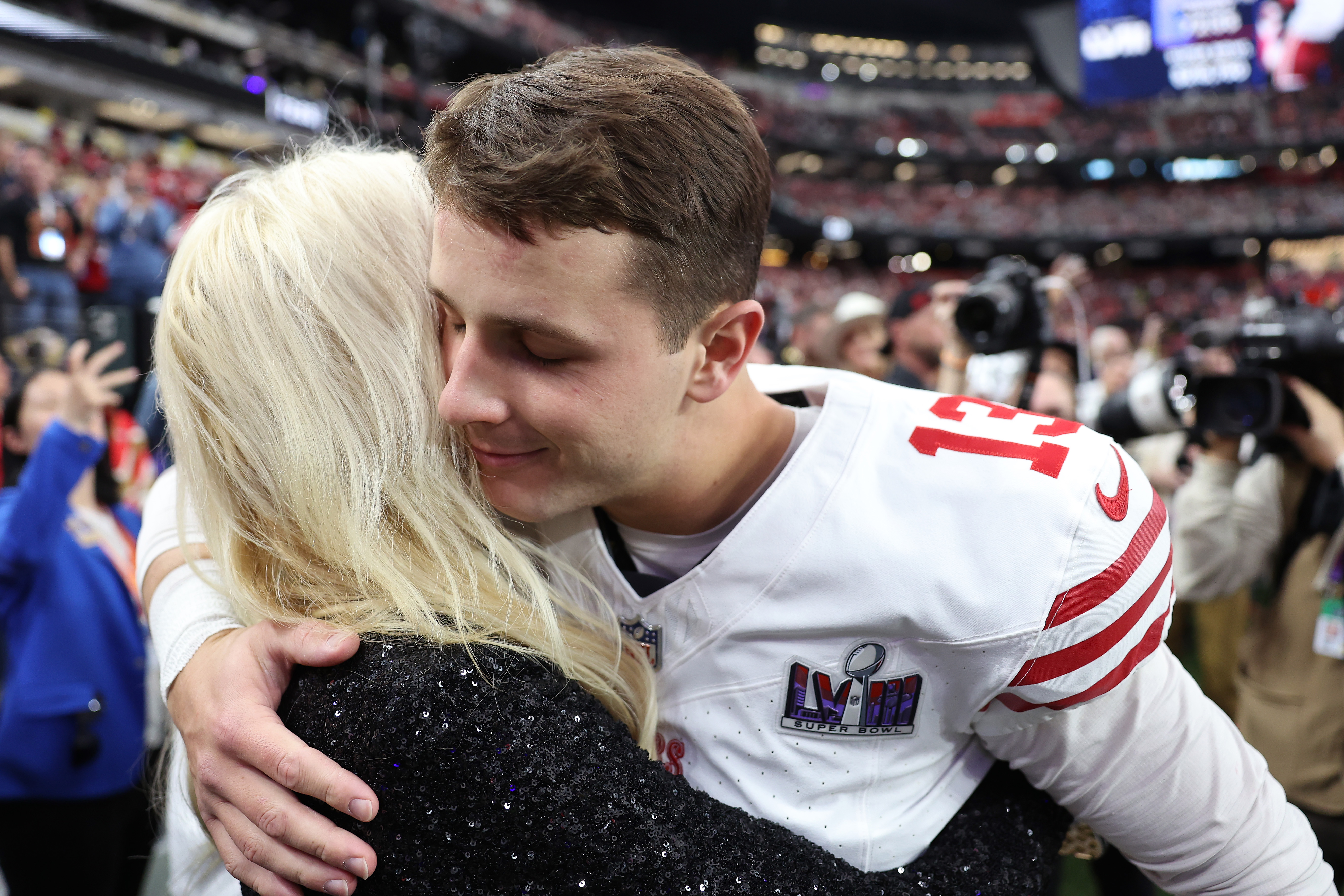 Brock Purdy #13 of the San Francisco 49ers hugs fiancée Jenna Brandt before Super Bowl LVIII against the Kansas City Chiefs at Allegiant Stadium on February 11, 2024 in Las Vegas, Nevada.<br><em>(Photo by Ezra Shaw/Getty Images)</em>