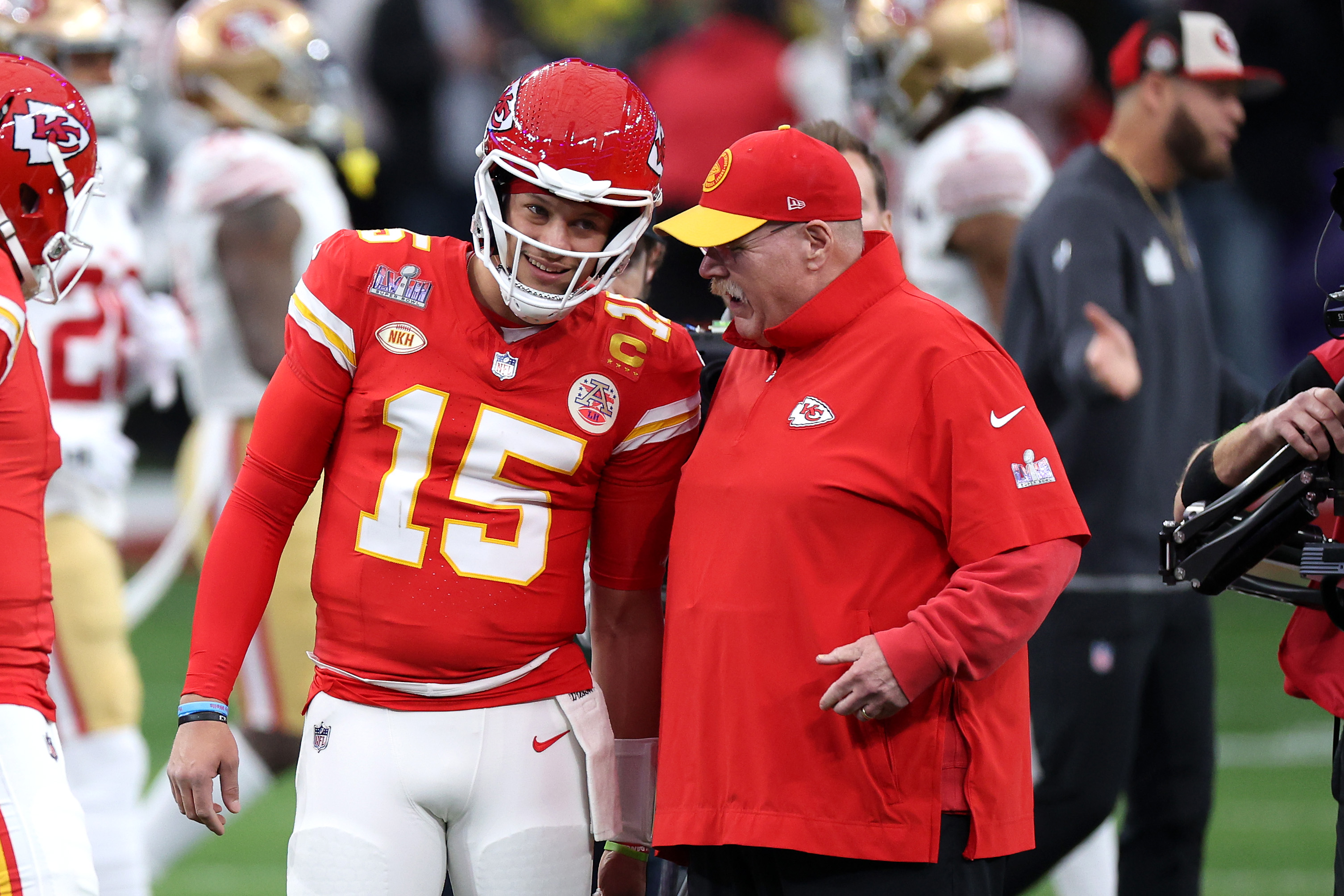 Patrick Mahomes #15 of the Kansas City Chiefs talks with head coach Andy Reid before Super Bowl LVIII against the San Francisco 49ers at Allegiant Stadium on February 11, 2024 in Las Vegas, Nevada.<br><em>(Photo by Harry How/Getty Images)</em>