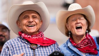 HOUSTON, TEXAS – FEBRUARY 24: Fred Marashi, left, and his wife, Barbara, enjoy the Houston Livestock Show and Rodeo parade, Saturday, Feb. 24, 2024, in Houston.
