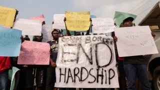 IBADAN, Nigeria – Feb. 19, 2024: Demonstrators hold placards during a protest against the hike in price and hard living conditions in Ibadan on February 19, 2024.