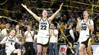 Guard Caitlin Clark and guard Kate Martin of the Iowa Hawkeyes celebrate in the confetti after winning a match-up against the Ohio State Buckeyes at Carver-Hawkeye Arena on March 3, 2024 in Iowa City, Iowa.