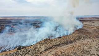 Firefighters battle the Smokehouse Creek Fire north of Canadian, Texas, Wednesday, Feb. 28, 2024