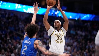 Indiana Pacers center Myles Turner (33) shoots as Dallas Mavericks’ Dereck Lively II (2) defends during the first half of an NBA basketball game Tuesday, March 5, 2024, in Dallas.