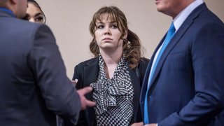 "Rust" movie armorer Hannah Gutierrez-Reed, center, talks with her attorney Jason Bowles, right, and her defense team during her involuntary manslaughter trial, Tuesday, March 5, 2024, at the First Judicial District Courthouse in Santa Fe, N.M.