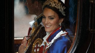 FILE - Kate, Princess of Wales and Prince William travel in a coach following the coronation ceremony of Britain's King Charles III in London, Saturday, May 6, 2023. (AP Photo/David Cliff, File)