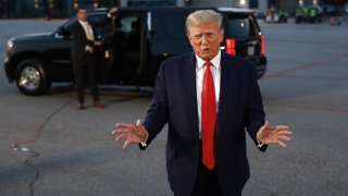 Former U.S. President Donald Trump speaks to the media at Atlanta Hartsfield-Jackson International Airport after surrendering at the Fulton County jail on August 24, 2023 in Atlanta, Georgia.