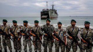 Iranian soldiers take part in an annual military drill in the coast of the Gulf of Oman and near the strategic Strait of Hormuz.