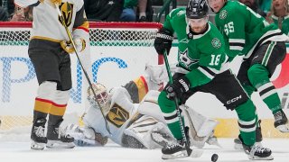 FILE – Vegas Golden Knights goaltender Logan Thompson, bottom, falls to the ice as Dallas Stars center Sam Steel (18) controls the puck during the second period of an NHL hockey game, Saturday, Dec. 9, 2023, in Dallas. All eight first-round matchups in the NHL playoffs are set after the last day of the regular season flipped two of the biggest series in the West. The defending Stanley Cup champion Vegas Golden Knights will open against the conference-champion Dallas Stars.