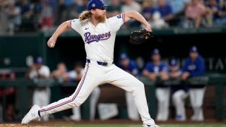 Texas Rangers starting pitcher Jon Gray throws to the Washington Nationals in the seventh inning of a baseball game in Arlington, Texas, Tuesday, April 30, 2024.