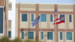 FILE - The FBI, American, and Georgia state flag fly outside the Atlanta Federal Bureau of Investigation field office