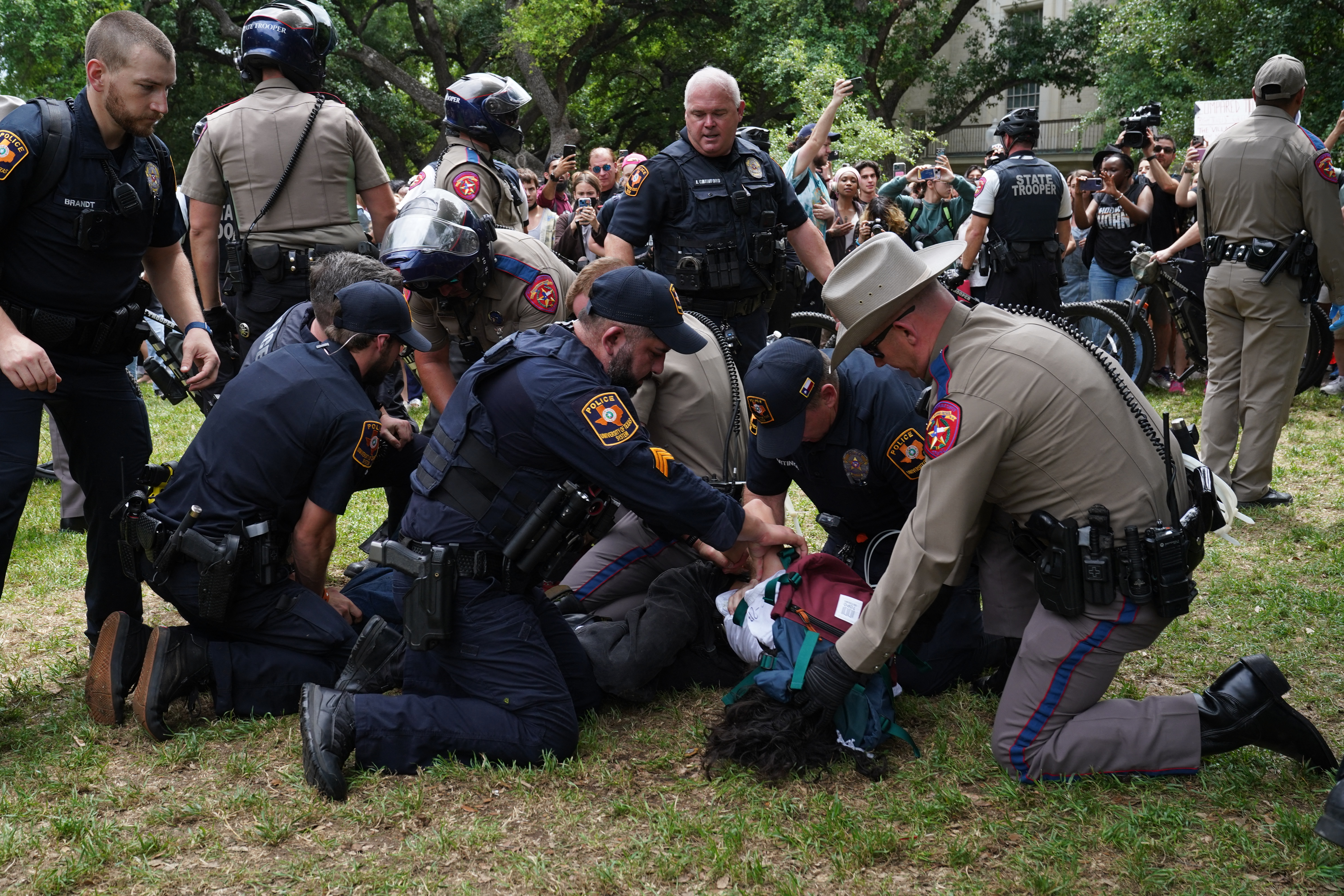 A person is detained by police as pro-Palestinian students protest the Israel-Hamas war on the University of Texas campus in Austin, on Wednesday, April 24, 2024.