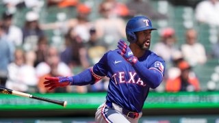 Texas Rangers’ Marcus Semien connects for a RBI single to center during the fifth inning of a baseball game against the Detroit Tigers, Tuesday, April 16, 2024, in Detroit. (AP Photo/Carlos Osorio)