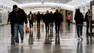 People walk through the newly opened Grand Central Madison train terminal in Manhattan on February 27, 2023 in New York City.