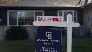 A “sale pending” sign is posted in front of a home for sale in San Anselmo, California, on Nov. 30, 2023.