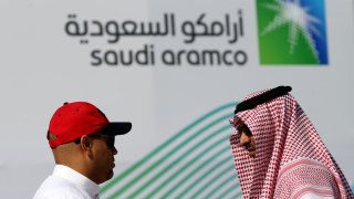 Members of media chat before the start of a press conference by Aramco at the Plaza Conference Center in Dhahran, Saudi Arabia November 3, 2019. 