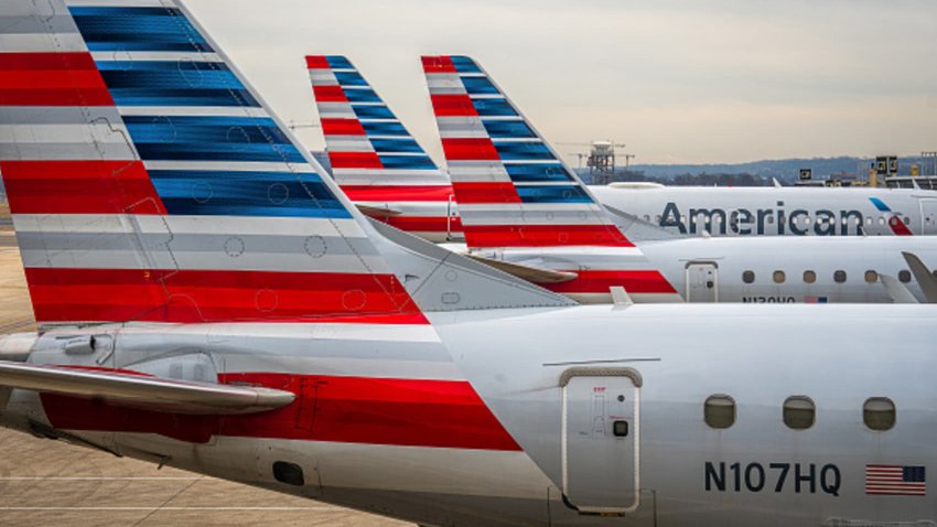 American Airlines passenger jets are lined up at the gates at Ronald Reagan Washington National Airport in Arlington, Virginia, on Feb. 10, 2024.