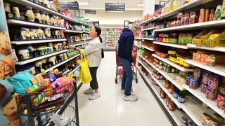 People shop in the food section of a retail store in Rosemead, California, Jan. 19, 2024.