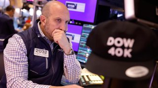 Traders work on the floor of the New York Stock Exchange during morning trading on May 17, 2024.