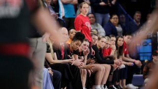 Players and staff on the Utah bench