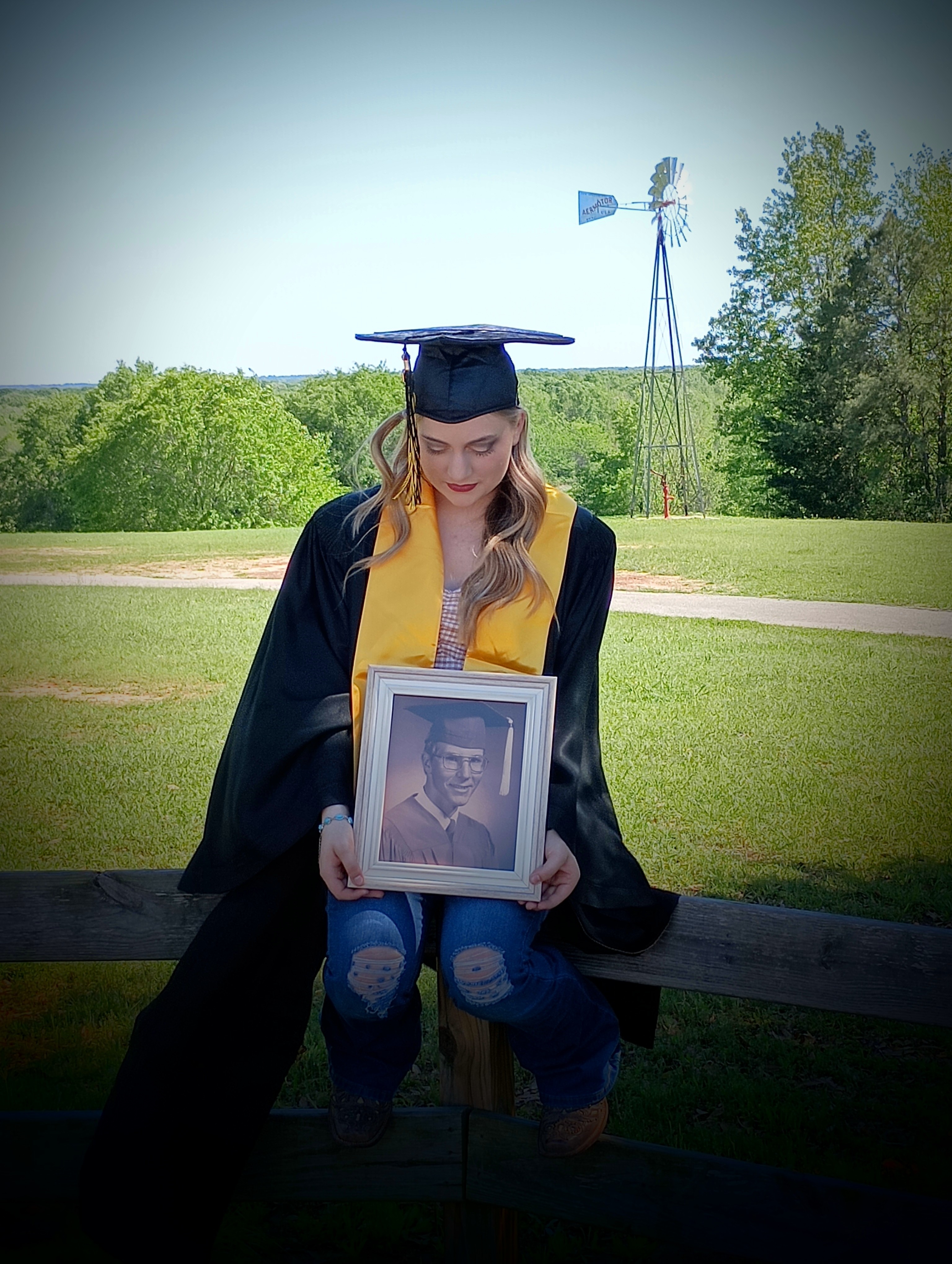 majoring in medical. Plans to be a NICU Nurse. This photo her grandmother<br />
took, it is Rae and her grandpa Ken. She is wearing his gown he wore when<br />
he graduated in 1977. He passed away in 2014.<br />
We are so proud of her!!!