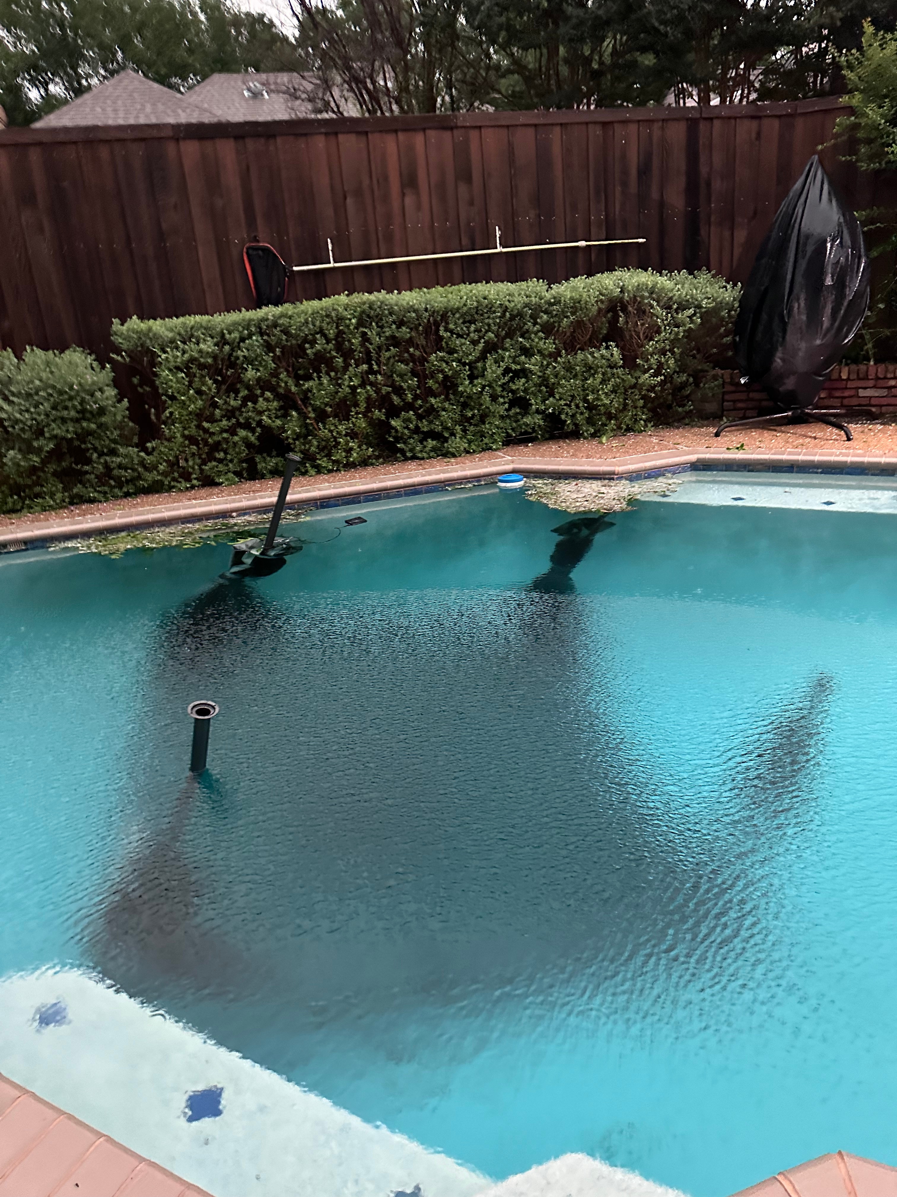 Cabana umbrella felt into the pool