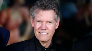 FILE – Randy Travis attends the announcement of the Country Music Hall of Fame inductees in Nashville, Tenn., on March 29, 2016.