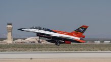 The X-62A VISTA aircraft, an experimental AI-enabled Air Force F-16 fighter jet, takes off on Thursday, May 2, 2024, at Edwards Air Force Base, Calif. The flight, with Air Force Secretary Frank Kendall riding in the front seat, is serving as a public statement of confidence in the future role of AI in air combat. The military is planning to use the technology to operate an unmanned fleet of 1,000 aircraft. (AP Photo/Damian Dovarganes)