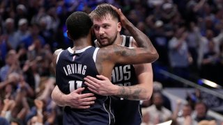Dallas Mavericks’ Kyrie Irving (11) and Luka Doncic, right, celebrate the team’s win in Game 3 of an NBA basketball second-round playoff series against the Oklahoma City Thunder, Saturday, May 11, 2024, in Dallas. (AP Photo/Tony Gutierrez)