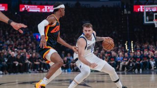 Dallas Mavericks guard Luka Doncic, right, works the floor against Oklahoma City Thunder guard Shai Gilgeous-Alexander during the first half of Game 5 of an NBA basketball second-round playoff series, Wednesday, May 15, 2024, in Oklahoma City. (AP Photo/Nate Billings)