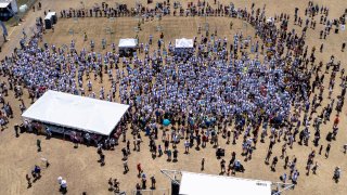 This photo taken by a drone and provided by the City of Kyle, Texas, shows an attempt by the city to break the world record for the largest gathering of people with one name, Saturday, May 18, 2024, in Kyle. (City of Kyle, Texas via AP)