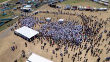 This photo taken by a drone and provided by the City of Kyle, Texas, shows an attempt by the city to break the world record for the largest gathering of people with one name, Saturday, May 18, 2024, in Kyle. (City of Kyle, Texas via AP)