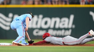Los Angeles Angels’ Luis Rengifo, right, is caught by Texas Rangers shortstop Corey Seager, left, while trying to steal second base against during the first inning of a baseball game in Arlington, Texas, Sunday, May 19, 2024. (AP Photo/LM Otero)