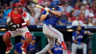 Texas Rangers’ Josh Smith follows through after hitting a run-scoring single against Philadelphia Phillies pitcher Taijuan Walker during the fifth inning of a baseball game, Wednesday, May 22, 2024, in Philadelphia.