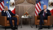 US President Joe Biden (R) speaks during a bilateral meeting with Mexican President Andres Manuel Lopez Obrador