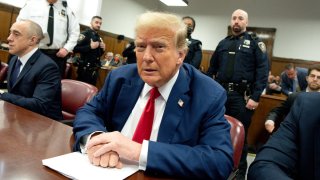 Former US President Donald Trump, center, and Emil Bove, attorney for former US President Donald Trump, left, at Manhattan criminal court in New York, US, on Monday, May 6, 2024. Trump faces 34 felony counts of falsifying business records as part of an alleged scheme to silence claims of extramarital sexual encounters during his 2016 presidential campaign. Photographer: Steven Hirsch/New York Post/Bloomberg