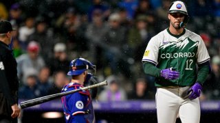 DENVER, COLORADO – MAY 11: Sean Bouchard #12 of the Colorado Rockies tosses his bat after being hit by a pitch in the seventh inning against the Texas Rangers at Coors Field on May 11, 2024 in Denver, Colorado. (Photo by Dustin Bradford/Getty Images)