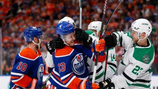 EDMONTON, ALBERTA – MAY 29: Mattias Janmark #13 of the Edmonton Oilers fights with Alexander Petrovic #28 and Esa Lindell #23 of the Dallas Stars during the second period in Game Four of the Western Conference Final of the 2024 Stanley Cup Playoffs at Rogers Place on May 29, 2024 in Edmonton, Alberta. (Photo by Codie McLachlan/Getty Images)