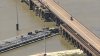 Bridge shut down after barge slams into it Galveston, causing oil spill