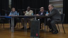 Royce West, second from left, attends a town hall addressing speed on Loop 12, May 9, 2024.