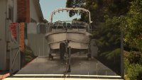 Man gets realistic picture of his boat painted on fence intended to hide it