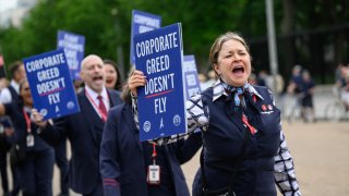 American Airlines flight attendants demonstrate outside the White House in Washington, May 9, 2024.