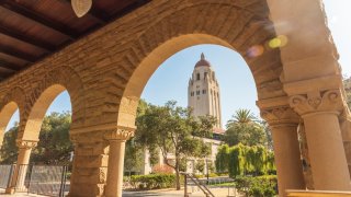 The Hoover Tower as seen through the arches of the Main Quadrangle on Stanford University campus. 