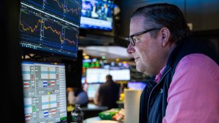 Traders work the floor of the New York Stock Exchange. 