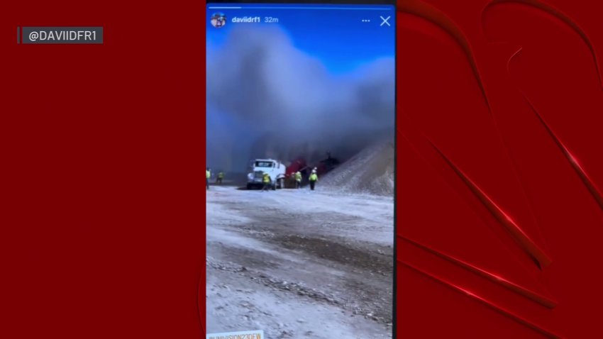 Video shows workers trying to put out fire after plane crash