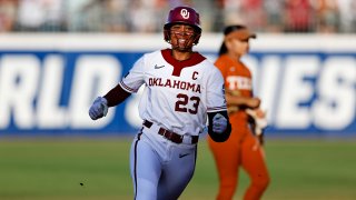 Oklahoma’s Tiare Jennings (23) smiles after hitting a home run against Texas during the first inning of Game 1 of the NCAA Women’s College World Series softball championship series Wednesday, June 5, 2024, in Oklahoma City.