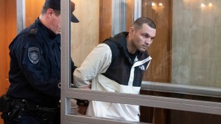 U.S. Army Staff Sgt. Gordon Black is escorted into a glass cage in courtroom in Vladivostok, Russia, Thursday, June 6, 2024. A court in Russia’s far eastern city of Vladivostok on Thursday began the trial of an American soldier arrested in the city earlier this year on charges of stealing. He faces up to five years in prison if convicted.