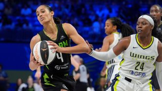 Seattle Storm guard Skylar Diggins-Smith (4) pulls the ball away from Dallas Wings guard Arike Ogunbowale (24) during the second half of a WNBA basketball basketball game in Arlington, Texas, Thursday, June 13, 2024. (AP Photo/LM Otero)