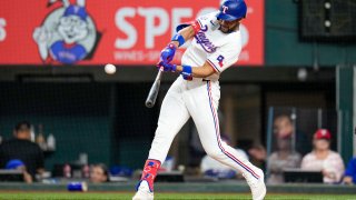 Texas Rangers’ Leody Taveras hits a two-run home run off New York Mets pitcher Drew Smith during the seventh inning of a baseball game, Wednesday, June 19, 2024, in Arlington, Texas. Rangers’ Corey Seager scored on the home run.