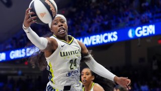 Dallas Wings guard Arike Ogunbowale (24) reaches for a rebound during the first half of the team’s WNBA basketball basketball game against the Seattle Storm in Arlington, Texas, Thursday, June 13, 2024. (AP Photo/LM Otero)