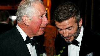 King Charles, (L) talks to Former England football captain David Beckham at the Global Premiere of “Our Planet” in London on April 4, 2019.